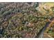 Aerial view of house nestled in wooded area with nearby roads at 2224 Taylor Rd, Shelby, NC 28152
