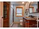 Bathroom with walk-in shower, granite vanity, and decorative tile at 2224 Taylor Rd, Shelby, NC 28152