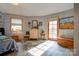 Bedroom with unique stone floor, dresser, and access to outdoor space at 2224 Taylor Rd, Shelby, NC 28152