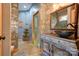 Bathroom with hand-painted walls, unique sink, and decorative mirror at 2224 Taylor Rd, Shelby, NC 28152