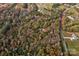 House nestled in a wooded area, accessible by a nearby road at 2224 Taylor Rd, Shelby, NC 28152