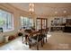 Charming dining area with wood table and chairs, and wooded views at 2224 Taylor Rd, Shelby, NC 28152