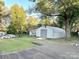 Large backyard with a metal storage building and deck at 2310 Belfast Dr, Charlotte, NC 28208