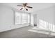 Sunny bedroom with ceiling fan and closet at 2318 Sweet Flag Ct, Charlotte, NC 28262