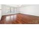 Living room with hardwood floors and ceiling fan at 2318 Sweet Flag Ct, Charlotte, NC 28262