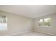 Bright bedroom with neutral walls and carpet flooring, featuring two large windows at 2702 New Hamlin Way, Charlotte, NC 28210