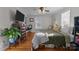 Spacious bedroom with king-size bed, hardwood floors, and built-in shelving at 325 Mayflower Ave, Cramerton, NC 28032