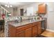 Eat-in kitchen with island and dark wood cabinets at 5414 Barley Ln, Charlotte, NC 28216