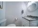 Clean and updated half bathroom with granite countertop at 119 Plantation Dr, Mooresville, NC 28117