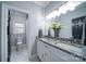 Bathroom with double vanity, granite countertop, and hexagon tile floor at 119 Plantation Dr, Mooresville, NC 28117