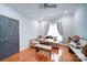 Bedroom with hardwood floors, built-in bench seating, and large window at 119 Plantation Dr, Mooresville, NC 28117