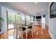 Bright dining area with hardwood floors and access to deck at 119 Plantation Dr, Mooresville, NC 28117