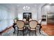 Elegant dining room with hardwood floors, a large table, and neutral decor at 119 Plantation Dr, Mooresville, NC 28117