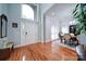 Two-story entryway with hardwood floors, chandelier, and adjacent dining area at 119 Plantation Dr, Mooresville, NC 28117