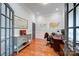 Home office with hardwood floors, built-in cabinetry, and a large desk at 119 Plantation Dr, Mooresville, NC 28117