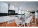 Spacious kitchen with white cabinets, stainless steel appliances, and granite countertops at 119 Plantation Dr, Mooresville, NC 28117