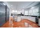 Gourmet kitchen features island, stainless steel appliances, and hardwood floors at 119 Plantation Dr, Mooresville, NC 28117