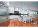 Spacious kitchen with white cabinets, stainless steel appliances, and granite countertops at 119 Plantation Dr, Mooresville, NC 28117