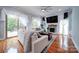 Living room features fireplace, hardwood floors, and large windows at 119 Plantation Dr, Mooresville, NC 28117