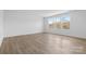 Spacious bedroom with wood-look floors and two large windows at 183 Sugar Hill Rd, Troutman, NC 28166