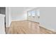 Bright bedroom with wood floors and three large windows at 183 Sugar Hill Rd, Troutman, NC 28166