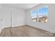 Well lit bedroom with double window and a door at 183 Sugar Hill Rd, Troutman, NC 28166