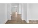 Bright hallway with light wood floors and access to other rooms at 183 Sugar Hill Rd, Troutman, NC 28166