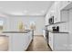 Modern kitchen featuring white cabinets, granite counters, and island at 183 Sugar Hill Rd, Troutman, NC 28166