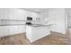 Modern kitchen with white cabinets, granite countertops and island at 183 Sugar Hill Rd, Troutman, NC 28166