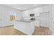 Modern kitchen with white cabinets, granite island, and stainless steel appliances at 183 Sugar Hill Rd, Troutman, NC 28166