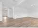 Open living room with hardwood floors and access to the front entrance at 183 Sugar Hill Rd, Troutman, NC 28166