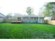 Spacious backyard featuring a deck and a well-maintained lawn at 4039 Uppergate Ln, Charlotte, NC 28215