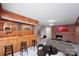 Inviting basement bar with seating and a fireplace for entertaining at 5419 Doncaster Dr, Charlotte, NC 28211