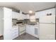 Efficient kitchen with white cabinets and appliances at 108,109 Sailors Ct # 108109, Mount Gilead, NC 27306