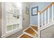 Elegant staircase with hardwood treads and white railings at 14108 Tooley St, Huntersville, NC 28078