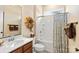 Bathroom with tub, shower, and wood vanity at 171 Chimney Rock Ct, Denver, NC 28037