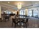 Community dining area with multiple tables and chairs at 230 S Tryon St # 205, Charlotte, NC 28202