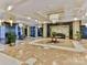 Elegant lobby with marble floors and modern chandelier at 230 S Tryon St # 205, Charlotte, NC 28202