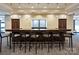 Modern bar with dark countertop and comfortable barstools at 230 S Tryon St # 205, Charlotte, NC 28202
