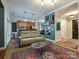 Open concept living room showcasing stylish decor and hardwood floors at 230 S Tryon St # 205, Charlotte, NC 28202