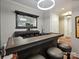 Well-appointed home bar with mirror and ample storage at 230 S Tryon St # 205, Charlotte, NC 28202