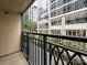 Private balcony overlooking city street and high-rise buildings at 230 S Tryon St # 205, Charlotte, NC 28202