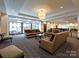 Elegant lobby with comfortable seating and modern light fixtures at 230 S Tryon St # 205, Charlotte, NC 28202