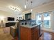 Modern kitchen with granite countertops and wooden cabinetry at 230 S Tryon St # 205, Charlotte, NC 28202