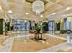 Spacious lobby featuring a large chandelier and seating area at 230 S Tryon St # 205, Charlotte, NC 28202