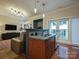 Open kitchen with granite countertops and modern fixtures at 230 S Tryon St # 205, Charlotte, NC 28202