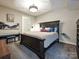 Spacious bedroom with a king-size bed and neutral decor at 230 S Tryon St # 205, Charlotte, NC 28202