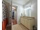 Bathroom with granite countertop vanity and a shower/tub combo at 230 S Tryon St # 205, Charlotte, NC 28202