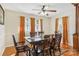 Bright dining room with wood table and orange curtains at 508 3Rd Ne Ave, Conover, NC 28613