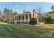 Brick ranch house with a covered porch and a large backyard at 508 3Rd Ne Ave, Conover, NC 28613